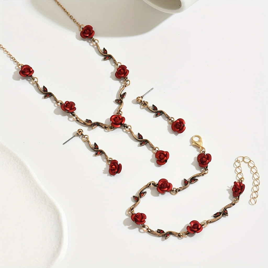 Jewelry set with red rose-themed necklace, earrings, and bracelet on a white background
