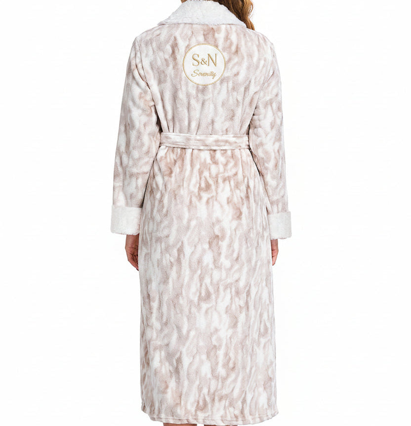 Woman wearing a patterned robe on a white background