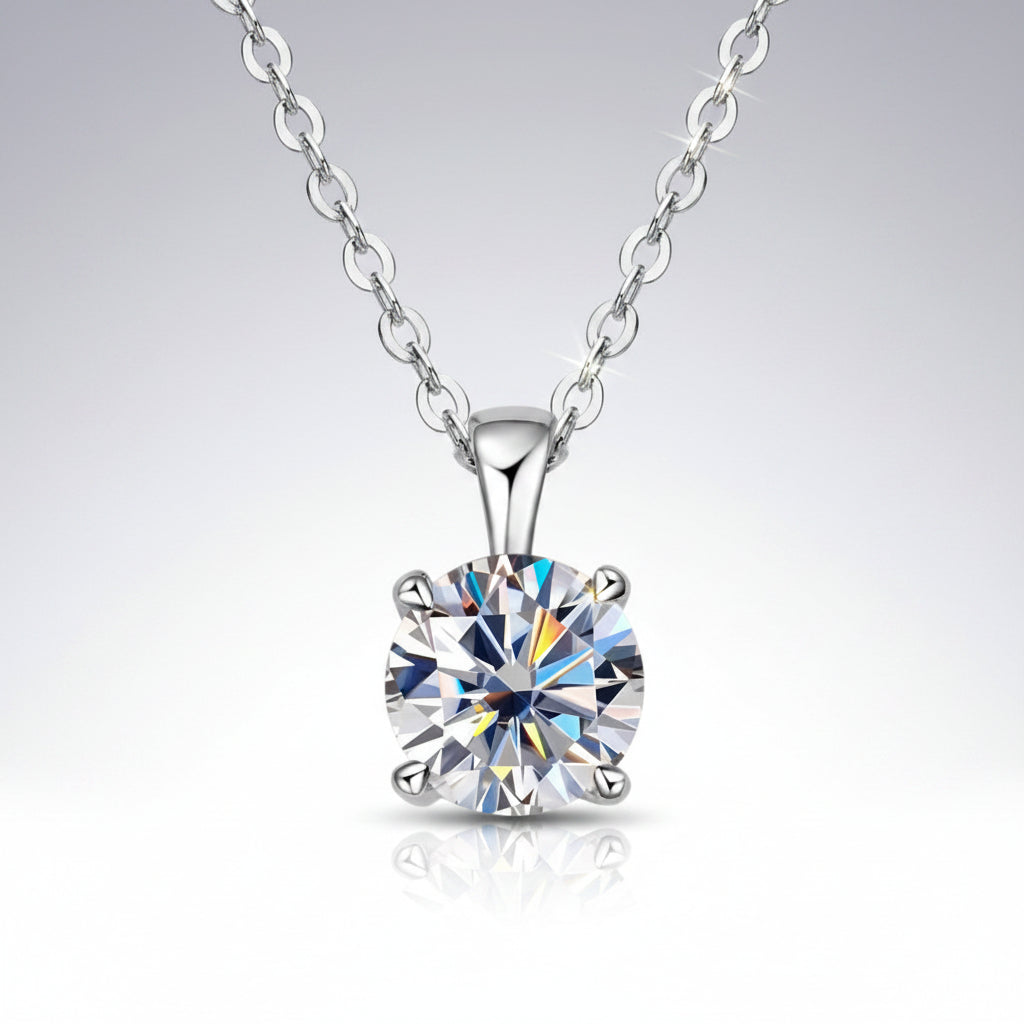 Silver necklace with a round diamond pendant on a white background