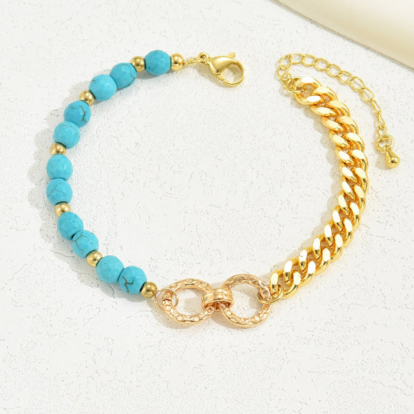 Bracelet with turquoise beads and gold chain on a white background