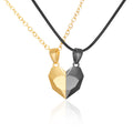 Two-tone geometric pendant necklace on a white background