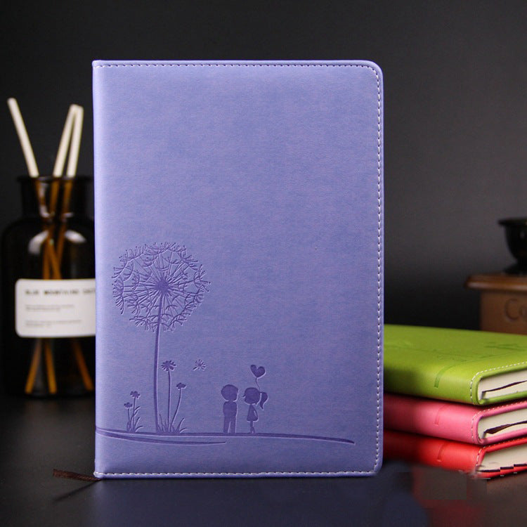 Purple notebook with dandelion design on a dark background
