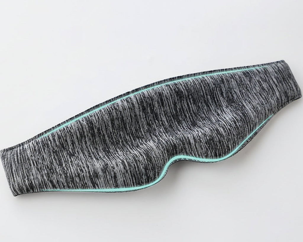 Textured material sample with wavy pattern on a light gray background