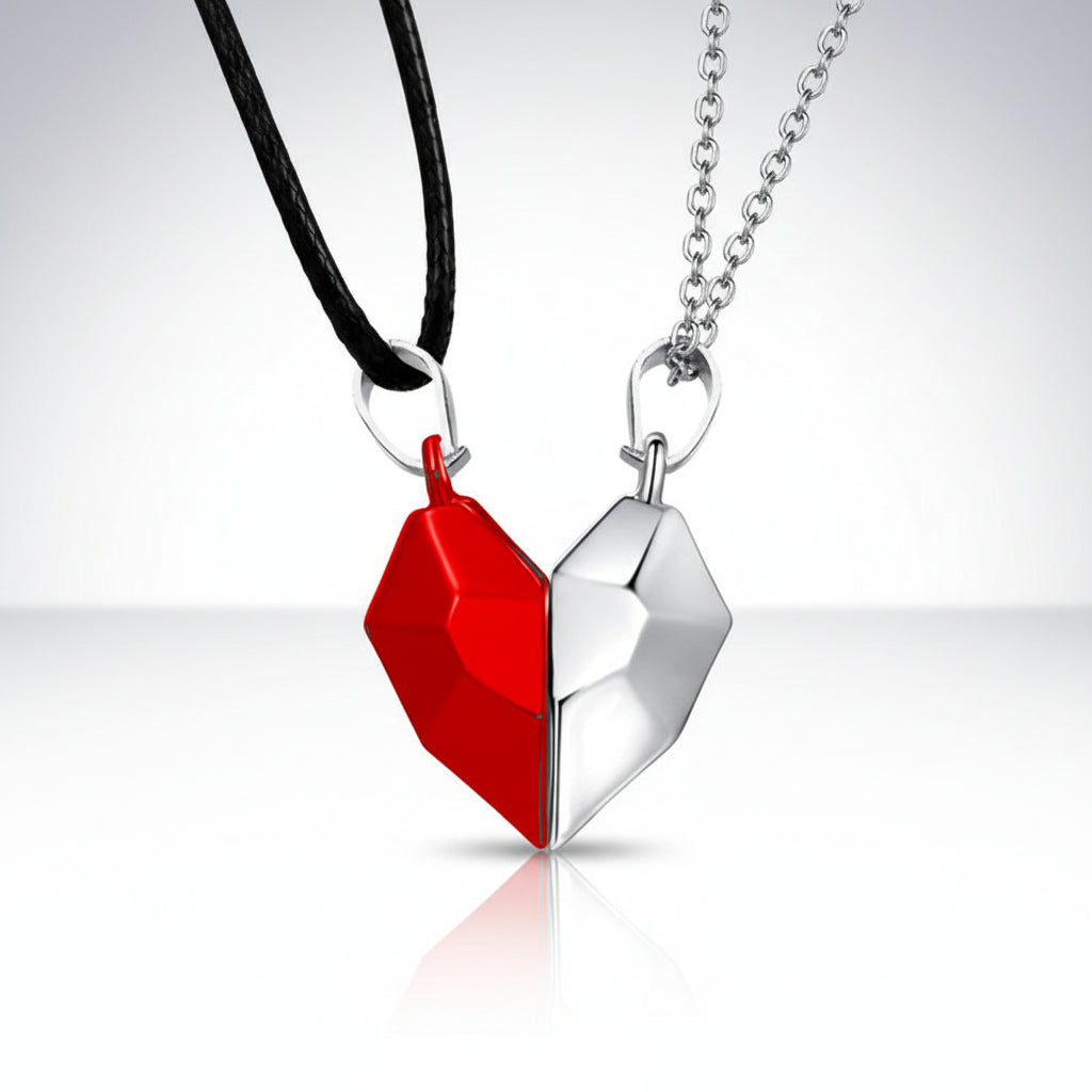 Two heart-shaped pendants, one red and one silver, on black and silver chains respectively.