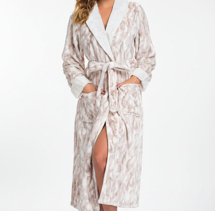 Woman wearing a patterned robe on a white background
