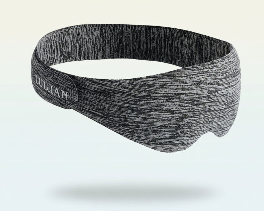 Gray sleep mask with 'YANLIAN' branding on a light beige background