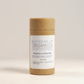 Butter Me Up Organics organic lotion bar with eucalyptus leaves on a white background