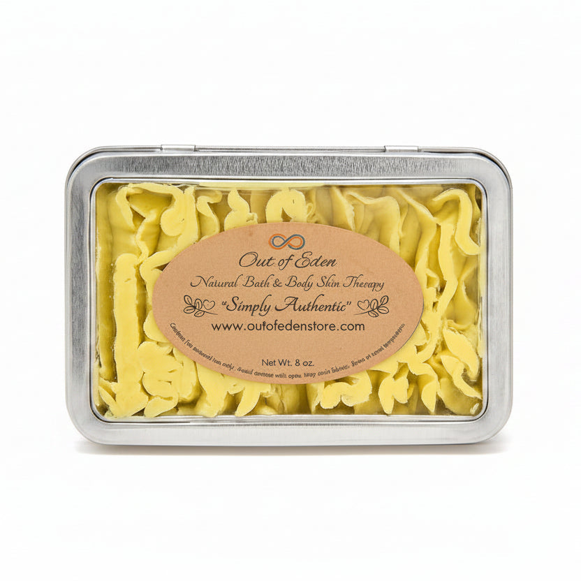 Yellow bath salts in a silver tin with a decorative label, surrounded by red roses on a white background.