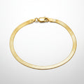 Gold bracelet on a white background