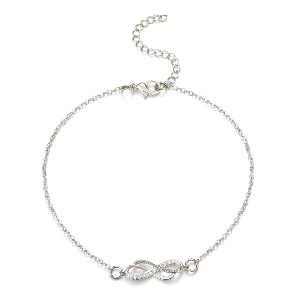 Silver bracelet with a double infinity symbol charm on a white background