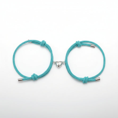 Two turquoise bracelets with metal clasps on a white background.