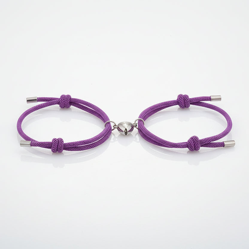 Two purple bracelets with silver clasps on a white background.