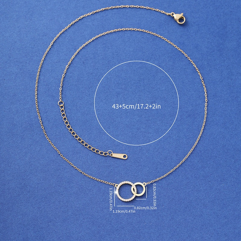 Silver necklace with interlocking rings on a blue background